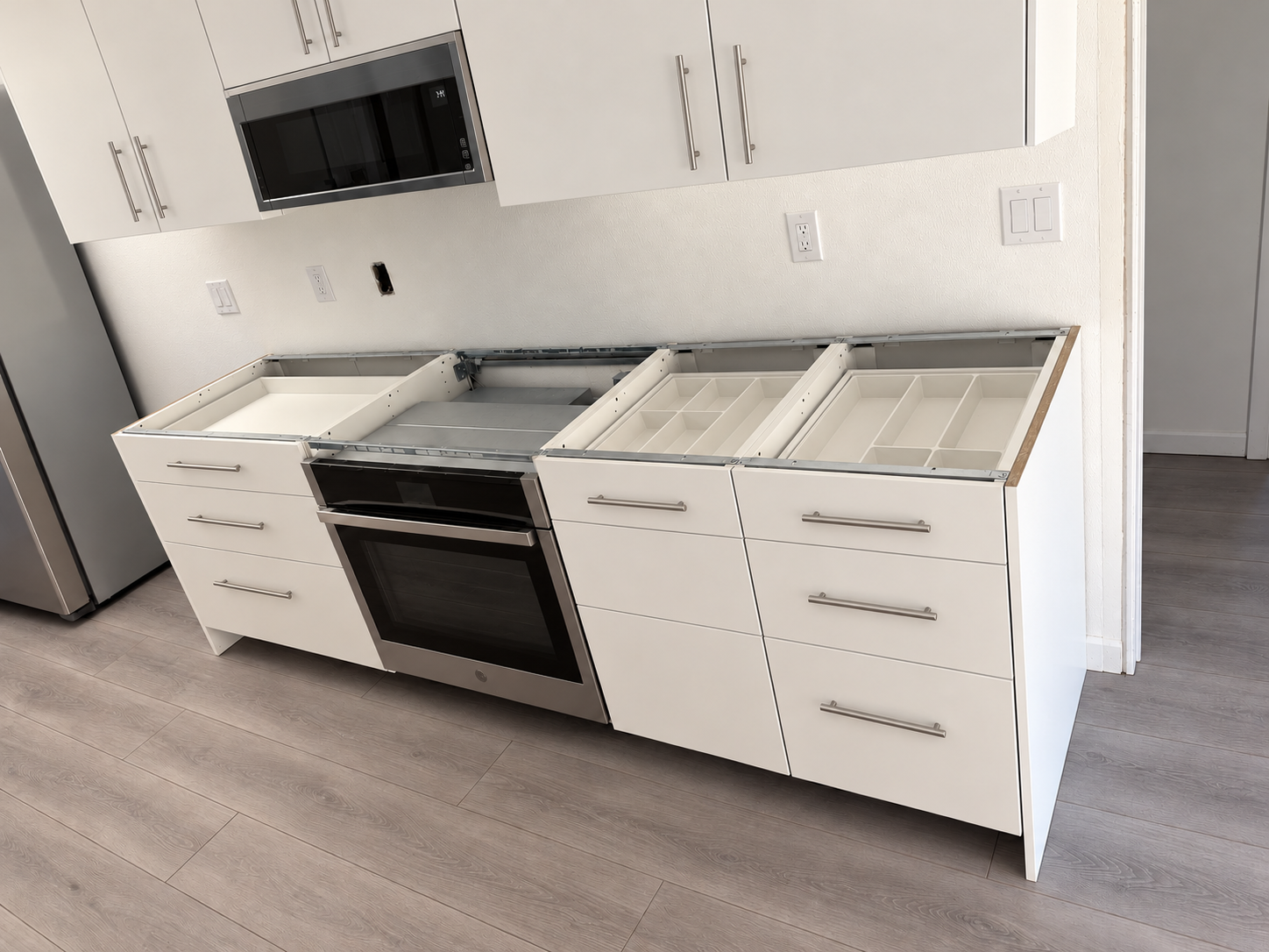 Kitchen base cabinets and oven before countertop installation